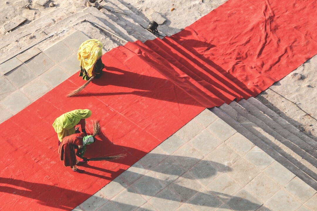 celebrity walking red carpet in bold outfit